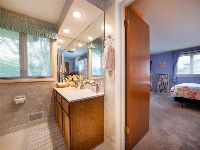 39 Sahara Dr, Gates, NY 14624 - ensuite bathroom with vanity and a textured ceiling