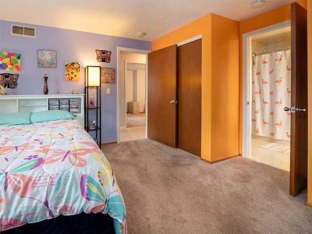 39 Sahara Dr, Gates, NY 14624 - carpeted bedroom with a closet, ensuite bath, and baseboards