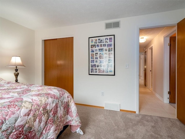 39 Sahara Dr, Gates, NY 14624 - bedroom featuring light tile patterned flooring, light carpet, and baseboards