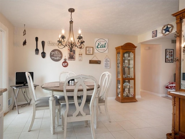 39 Sahara Dr, Gates, NY 14624 - dining space featuring a chandelier, light tile patterned floors, and baseboards