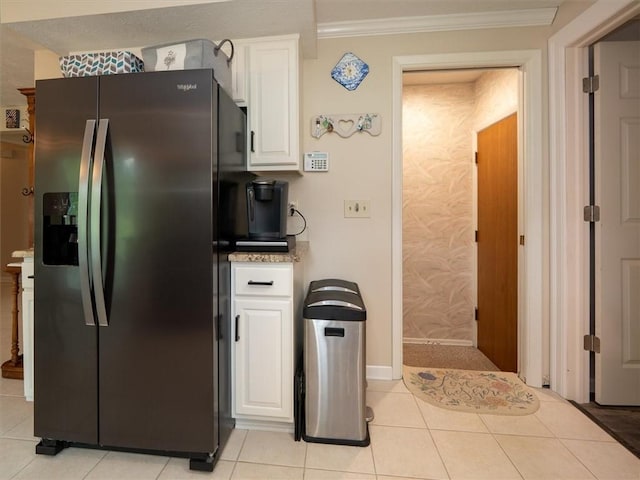 39 Sahara Dr, Gates, NY 14624 - kitchen with stainless steel fridge, white cabinets, crown molding, light countertops, and light tile patterned floors