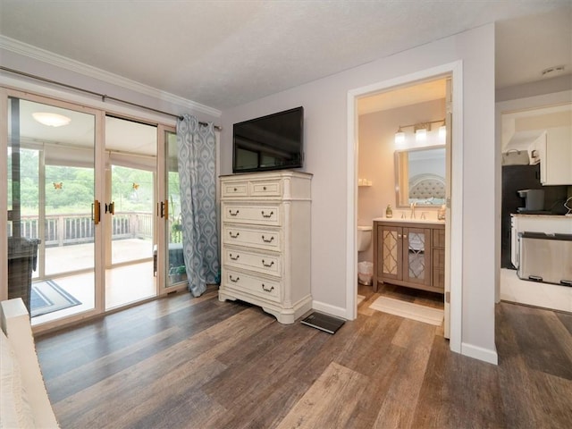 39 Sahara Dr, Gates, NY 14624 - bedroom featuring dark wood-type flooring, access to outside, baseboards, crown molding, and connected bathroom