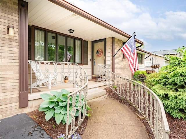 39 Sahara Dr, Gates, NY 14624 - property entrance with brick siding and covered porch