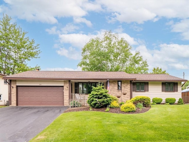 39 Sahara Dr, Gates, NY 14624 - ranch-style home featuring a garage, driveway, brick siding, and a front lawn