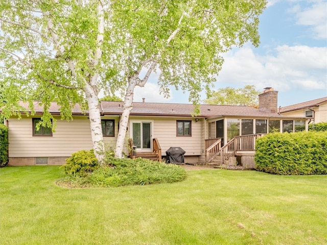 39 Sahara Dr, Gates, NY 14624 - back of house with a sunroom, a lawn, a chimney, and entry steps