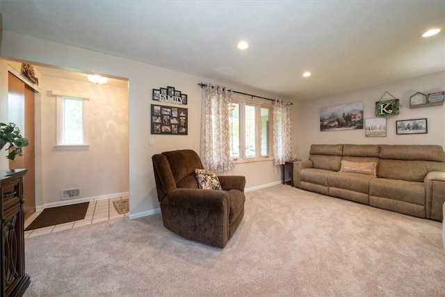 39 Sahara Dr, Gates, NY 14624 - carpeted living room featuring baseboards, plenty of natural light, recessed lighting, and tile patterned flooring