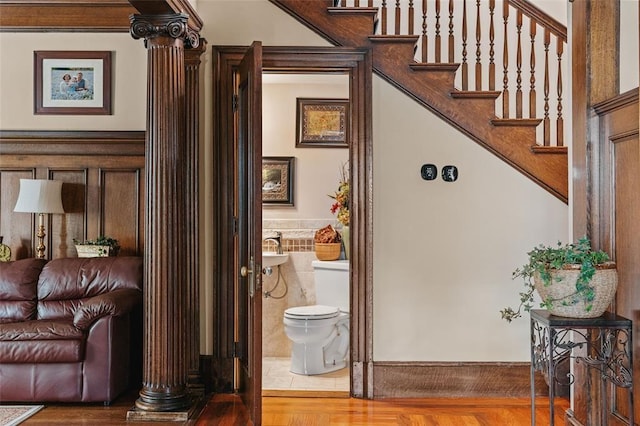 44 Riverside Dr, Binghamton-City, NY 13905 - staircase featuring tile walls, wainscoting, and wood finished floors
