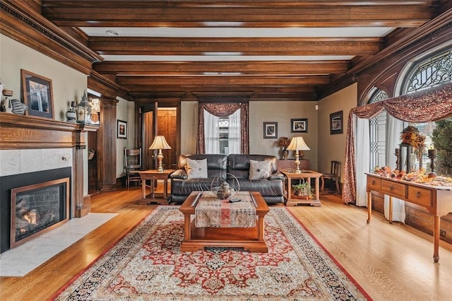 44 Riverside Dr, Binghamton-City, NY 13905 - living room featuring a tile fireplace, beamed ceiling, and wood finished floors