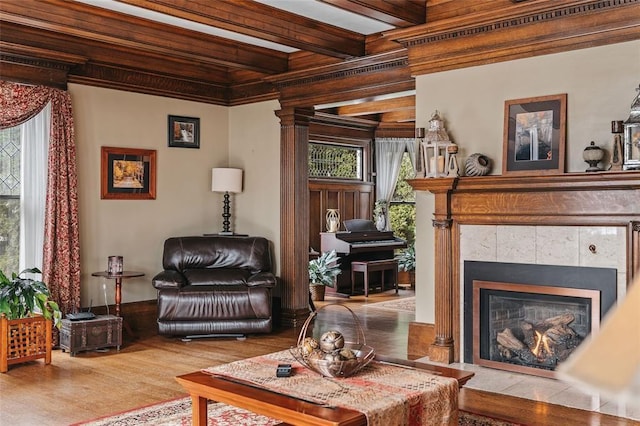 44 Riverside Dr, Binghamton-City, NY 13905 - living area with wood finished floors, beamed ceiling, and a tiled fireplace