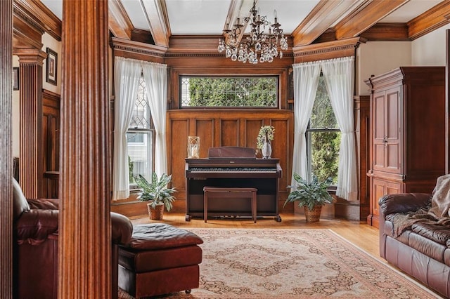 44 Riverside Dr, Binghamton-City, NY 13905 - sitting room with crown molding, a chandelier, wood finished floors, and decorative columns
