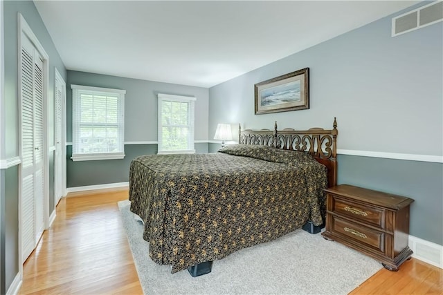 18 Chesham Way, Perinton, NY 14450 - bedroom featuring light wood-type flooring and baseboards
