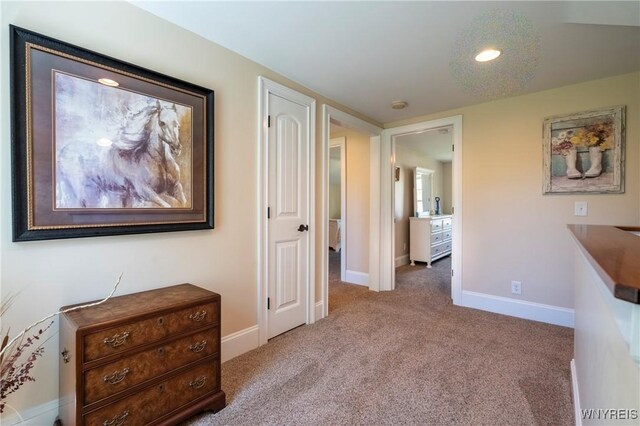 8785 Main St, Clarence, NY 14221 - corridor featuring carpet floors and baseboards
