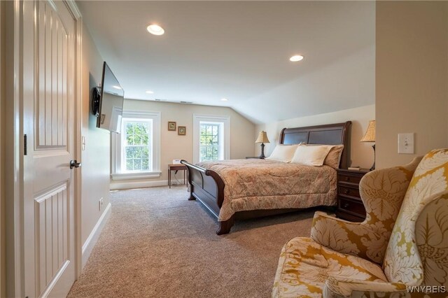 8785 Main St, Clarence, NY 14221 - carpeted bedroom with recessed lighting, baseboards, and vaulted ceiling