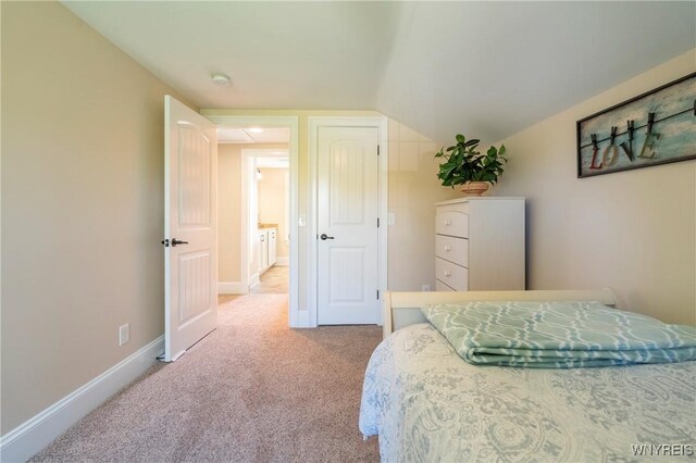 8785 Main St, Clarence, NY 14221 - carpeted bedroom featuring baseboards and vaulted ceiling