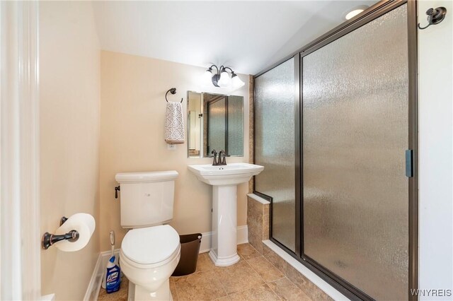 8785 Main St, Clarence, NY 14221 - full bath with toilet, a stall shower, tile patterned floors, and baseboards