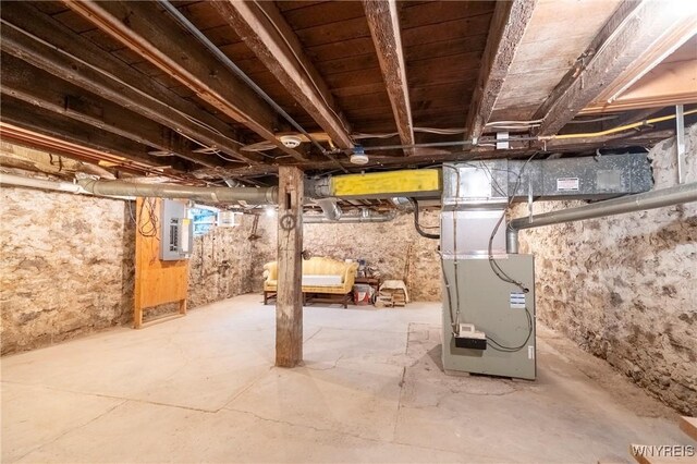 8785 Main St, Clarence, NY 14221 - unfinished basement with electric panel and heating unit