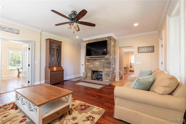 8785 Main St, Clarence, NY 14221 - living area featuring ceiling fan, ornamental molding, a fireplace, wood finished floors, and baseboards