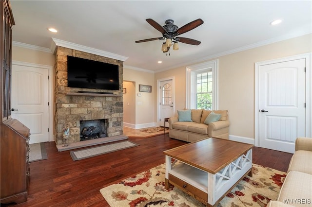 8785 Main St, Clarence, NY 14221 - living room with wood finished floors, ceiling fan, ornamental molding, a stone fireplace, and baseboards