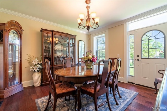 8785 Main St, Clarence, NY 14221 - dining space with a chandelier, baseboards, dark wood finished floors, and ornamental molding