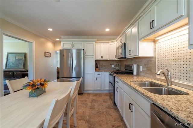 8785 Main St, Clarence, NY 14221 - kitchen with appliances with stainless steel finishes, a sink, tasteful backsplash, light stone counters, and recessed lighting