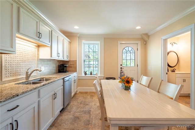 8785 Main St, Clarence, NY 14221 - kitchen with a sink, stainless steel dishwasher, crown molding, backsplash, and light stone counters