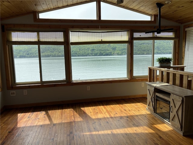 8976 Trio Dr, Urbana, NY 14840 - sunroom with vaulted ceiling and a water view