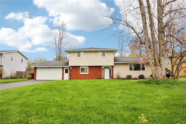489 Bridgewood Dr, Greece, NY 14612 - view of front facade with driveway, an attached garage, a front lawn, and brick siding