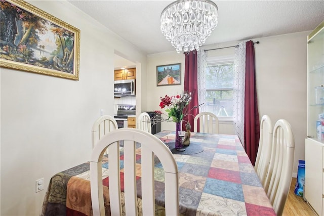 489 Bridgewood Dr, Greece, NY 14612 - dining area with a chandelier and light wood finished floors