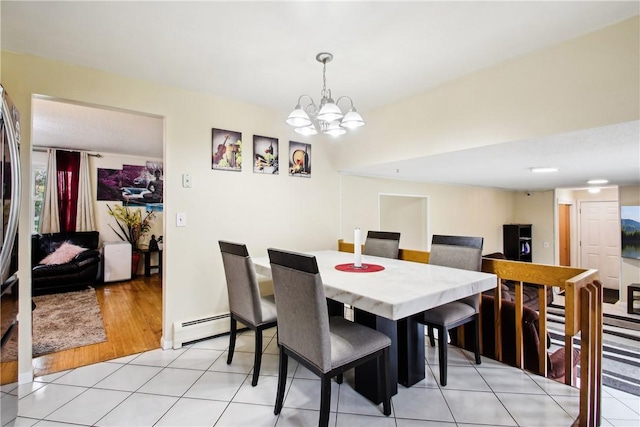 489 Bridgewood Dr, Greece, NY 14612 - dining room featuring baseboard heating, a chandelier, and light tile patterned flooring