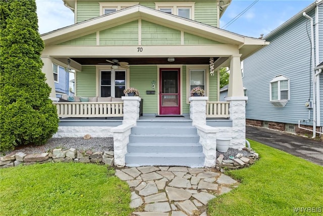 70 Seymour St, Tonawanda-City, NY 14150 - view of front of house featuring a porch, ceiling fan, and a front lawn