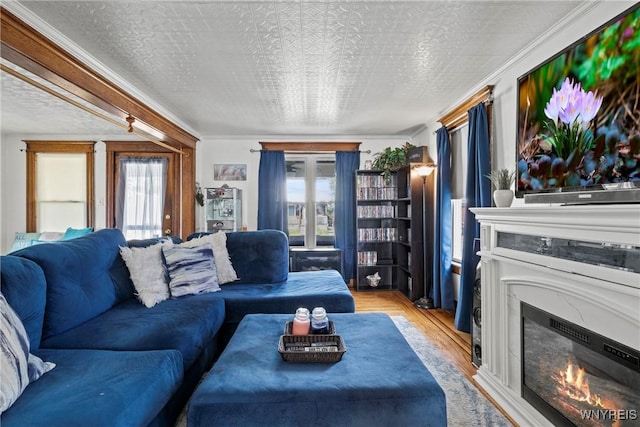 70 Seymour St, Tonawanda-City, NY 14150 - living area with light wood-style flooring, healthy amount of natural light, a high end fireplace, and a textured ceiling