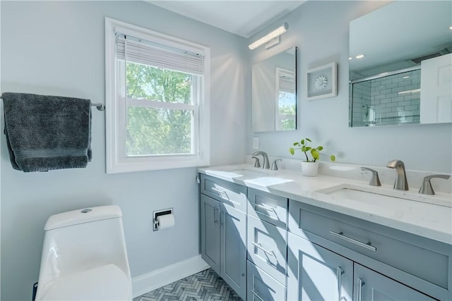 272 Shaftsbury Rd, Brighton, NY 14610 - full bathroom featuring double vanity, toilet, a tile shower, and baseboards