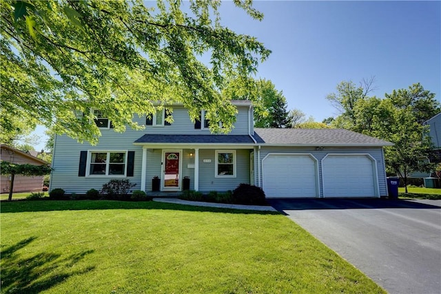 272 Shaftsbury Rd, Brighton, NY 14610 - view of front of house featuring an attached garage, asphalt driveway, and a front yard