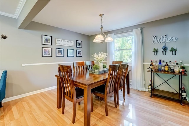 272 Shaftsbury Rd, Brighton, NY 14610 - dining room featuring light wood finished floors, a chandelier, and baseboards