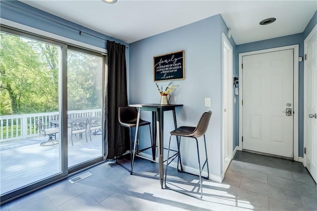 272 Shaftsbury Rd, Brighton, NY 14610 - tiled dining room featuring baseboards