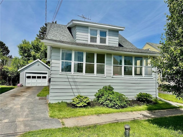 131 Hazelhurst Ave, Syracuse, NY 13206 - bungalow-style house with a garage, driveway, an outdoor structure, and roof with shingles