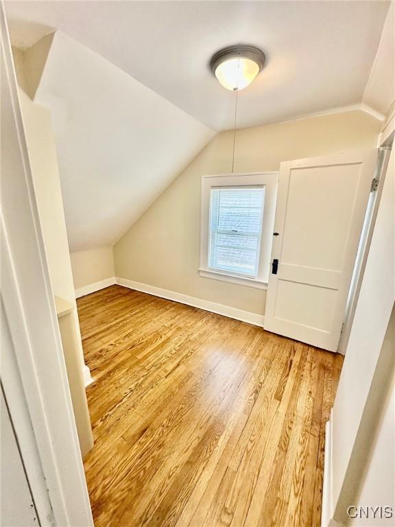 131 Hazelhurst Ave, Syracuse, NY 13206 - additional living space featuring lofted ceiling, light wood-type flooring, and baseboards