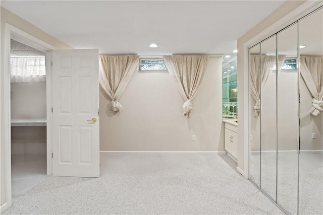 23 Sunberry Dr, Perinton, NY 14526 - unfurnished bedroom with baseboards, carpet floors, recessed lighting, a closet, and connected bathroom