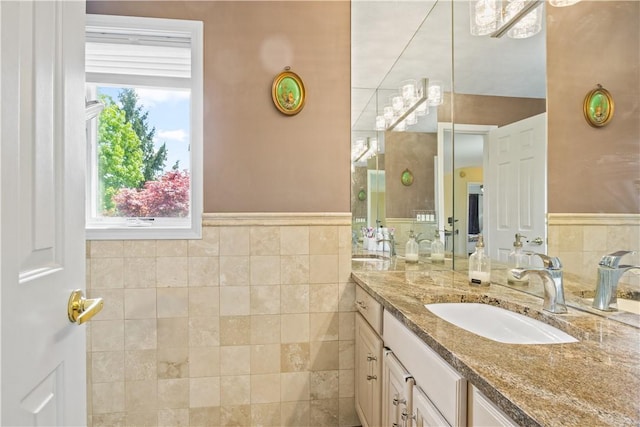 23 Sunberry Dr, Perinton, NY 14526 - bathroom with vanity, tile walls, and a wainscoted wall