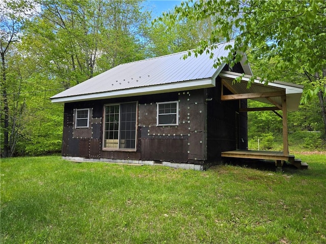 568 Country Rd, Davenport, NY 12155 - rear view of house with a yard and metal roof