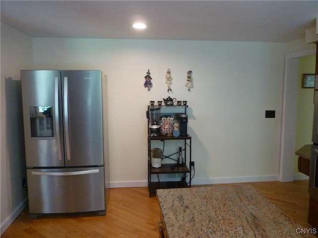3899 Sweet Rd, Pompey, NY 13078 - kitchen featuring stainless steel fridge with ice dispenser, light wood-style flooring, light stone counters, baseboards, and recessed lighting