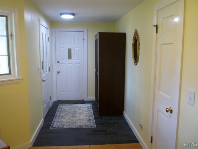 3899 Sweet Rd, Pompey, NY 13078 - entryway featuring baseboards and dark wood-style floors