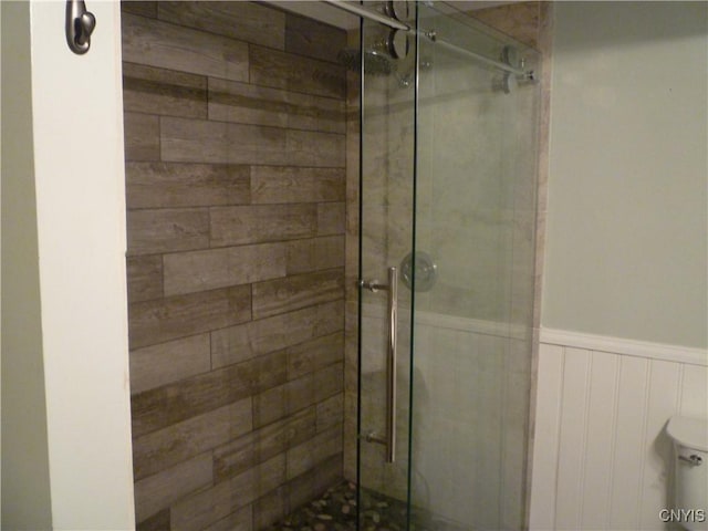 3899 Sweet Rd, Pompey, NY 13078 - bathroom with a shower stall, a wainscoted wall, and toilet