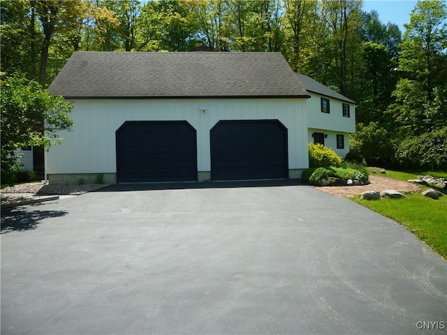 3899 Sweet Rd, Pompey, NY 13078 - view of front of home with driveway, roof with shingles, and a garage