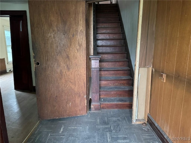1867 Pierce Ave, Niagara Falls, NY 14301 - staircase featuring tile patterned floors and wooden walls