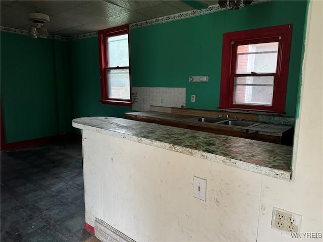1867 Pierce Ave, Niagara Falls, NY 14301 - kitchen featuring a sink, plenty of natural light, and dark floors