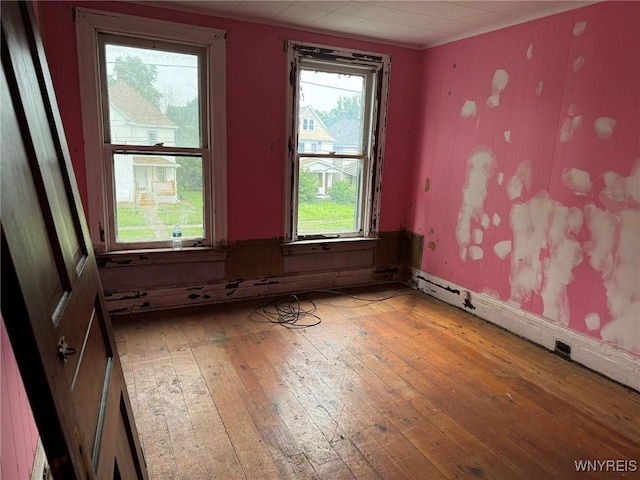 1867 Pierce Ave, Niagara Falls, NY 14301 - unfurnished room with light wood finished floors, a baseboard heating unit, and ornamental molding