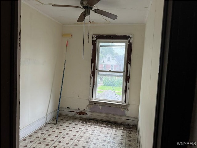 1867 Pierce Ave, Niagara Falls, NY 14301 - empty room with crown molding, light flooring, ceiling fan, and baseboards