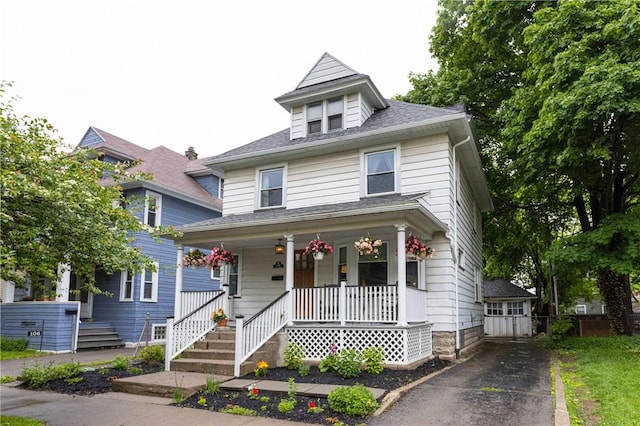 110 Lansdale St, Rochester, NY 14620 - american foursquare style home featuring covered porch, driveway, and a shingled roof