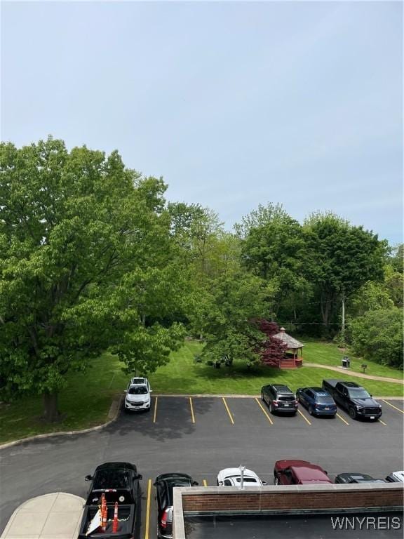 151 Buffalo Ave Unit 404, Niagara Falls, NY 14303 - uncovered parking lot with a forest view